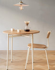 Round wooden cafe table and chair - Pedersen + Lennard