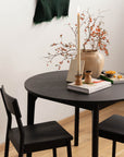 Round Black Wooden Dining Table - Pedersen + Lennard