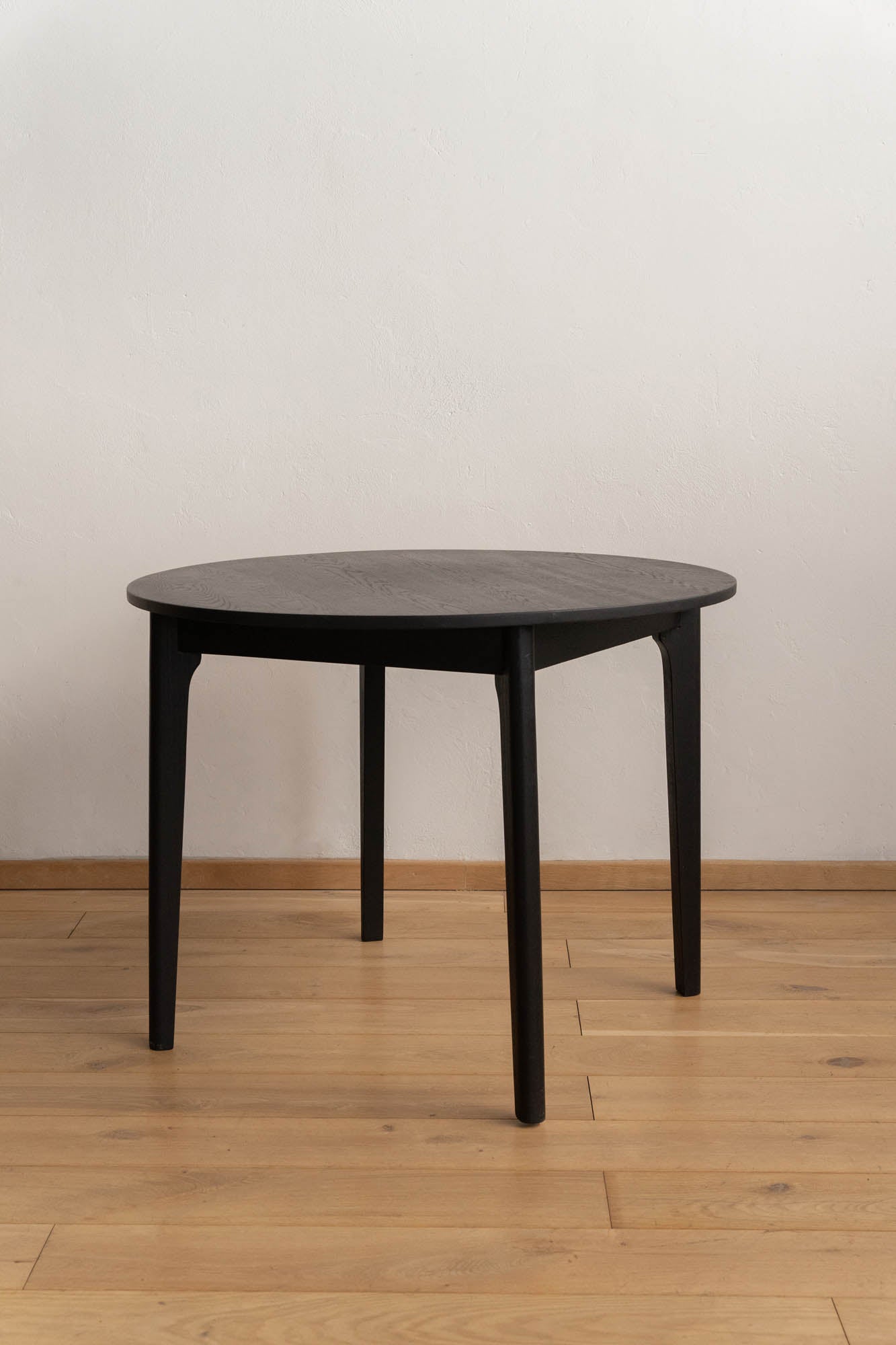 Round Black Wooden Dining Table - Pedersen + Lennard