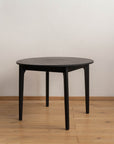 Round Black Wooden Dining Table - Pedersen + Lennard