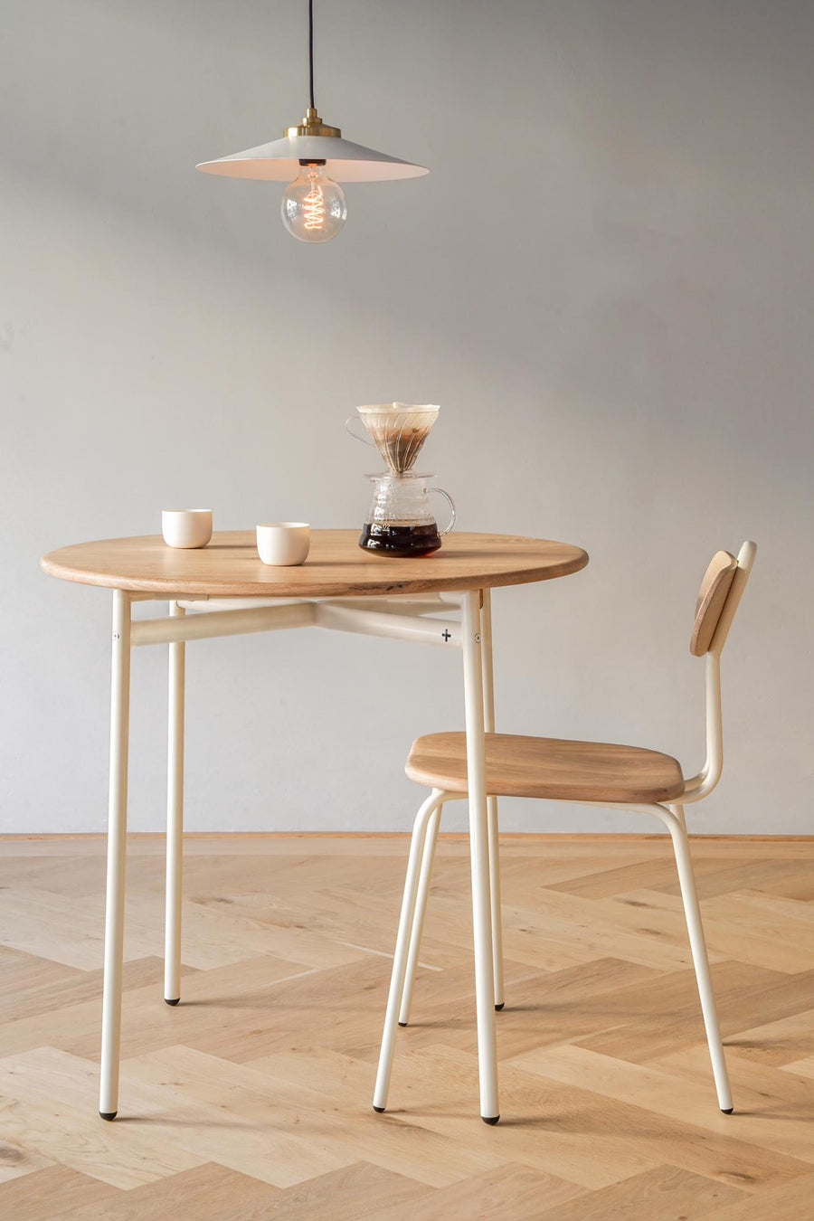 Round wooden cafe table and chair - Pedersen + Lennard